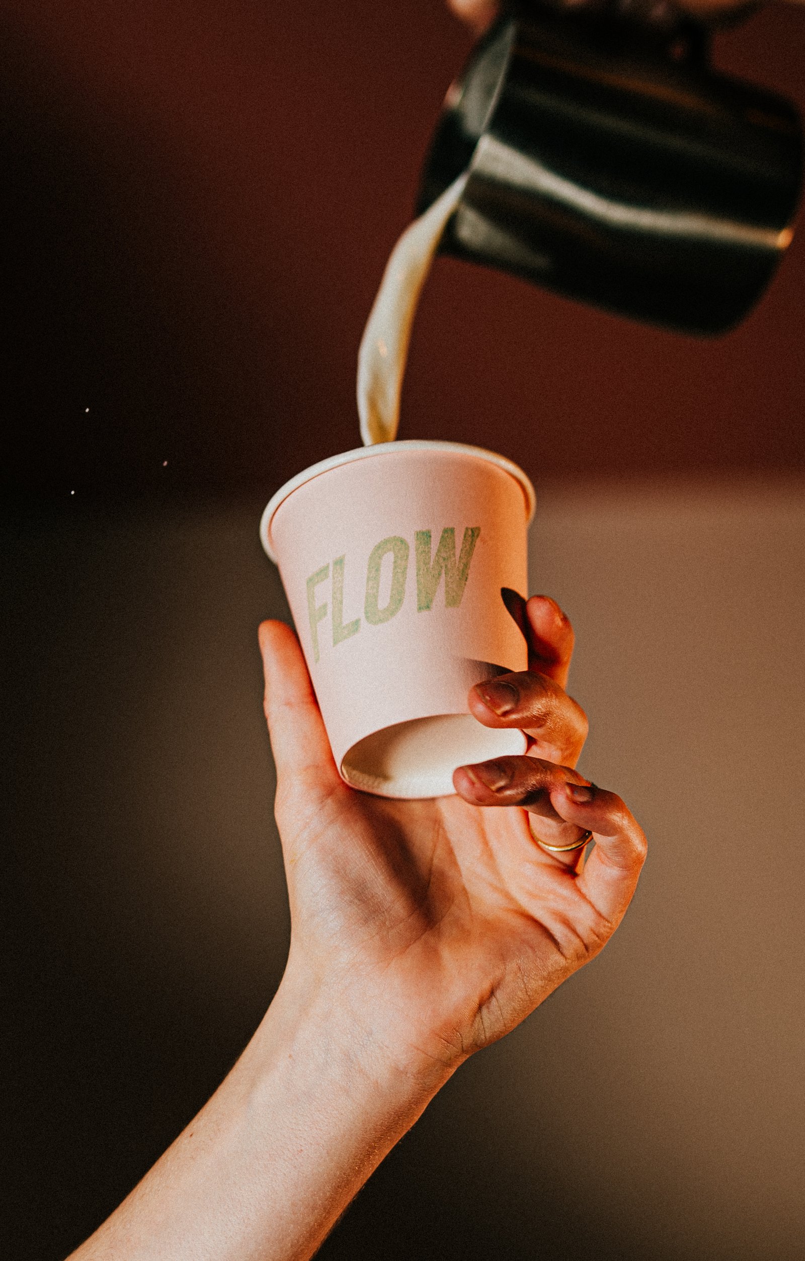 A person holding a cup of coffee