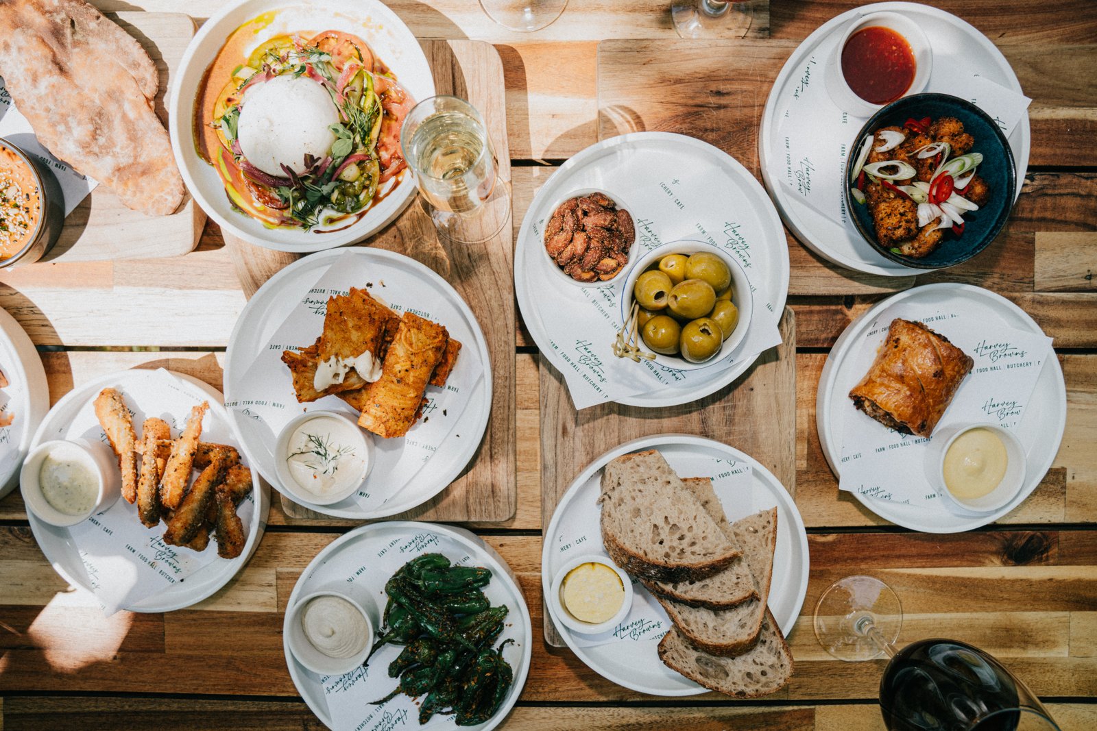 A table with bread, vegetables and dips